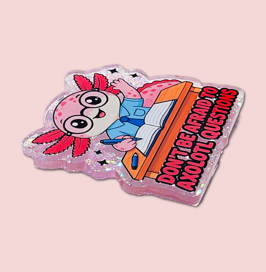 Side view of the Don't Be Afraid to Axolotl Questions badge topper