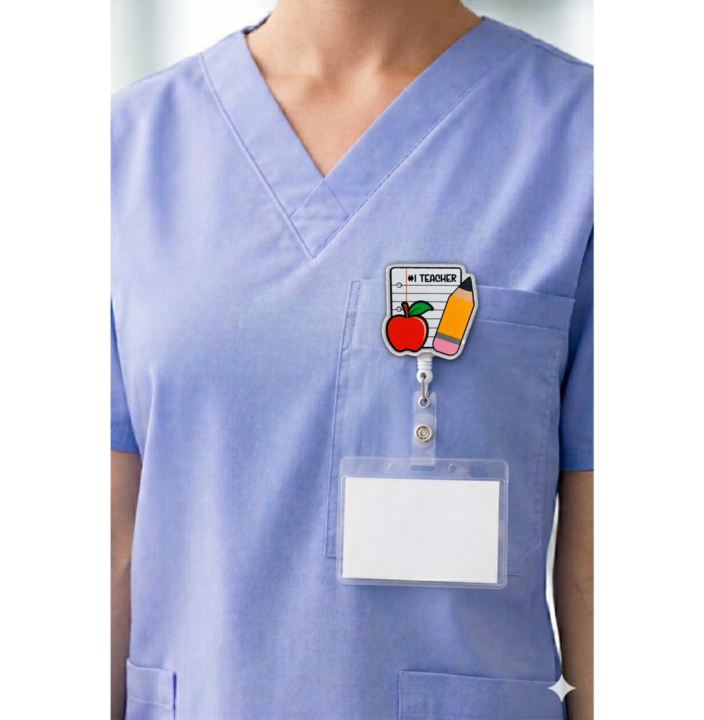 Number one teacher interchangeable badge topper shown on blue scrubs