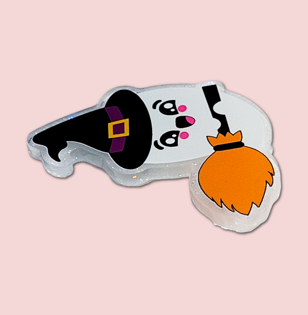 Witch ghost badge topper attached to an interchangeable badge reel