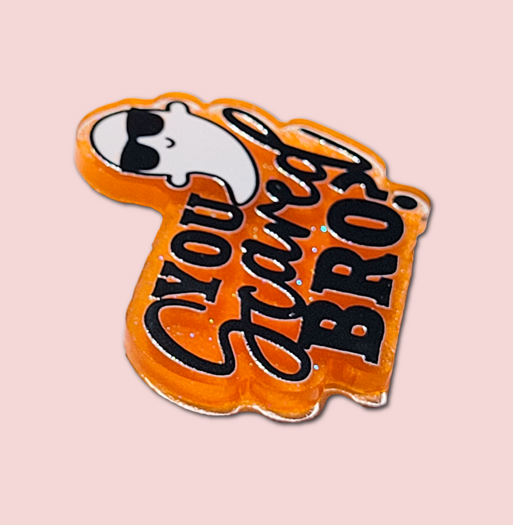 You Scared Bro badge topper attached to an interchangeable badge reel
